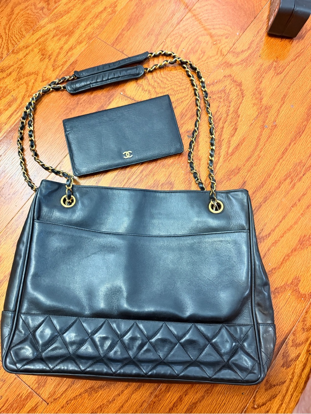 CHANEL Black Leather Shoulder Bag with Quilted Trim and Gold Chain